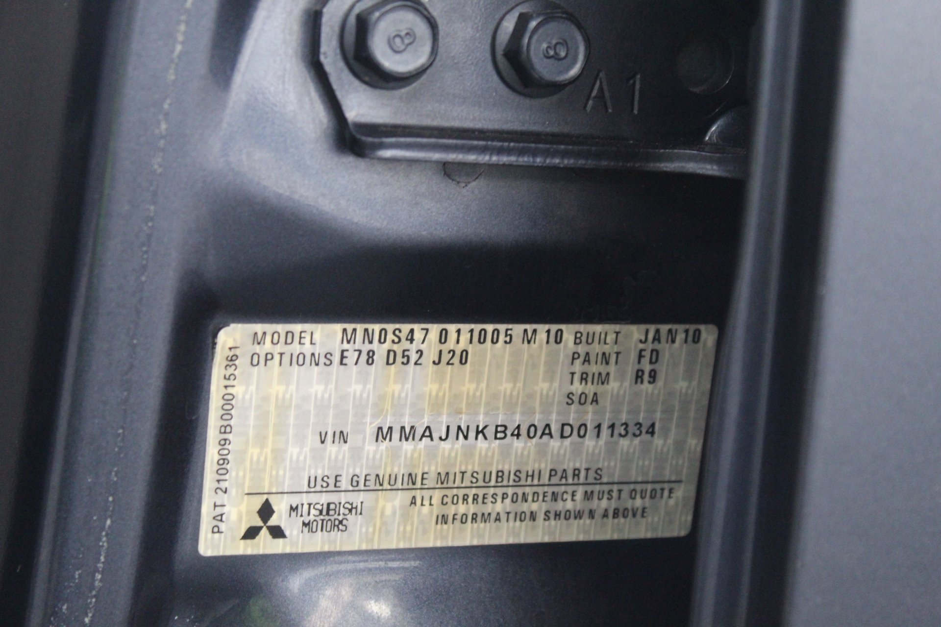 7.90ct a cushion cut Zambian emerald With AIG Cert. & 2.08ct 8 round stones