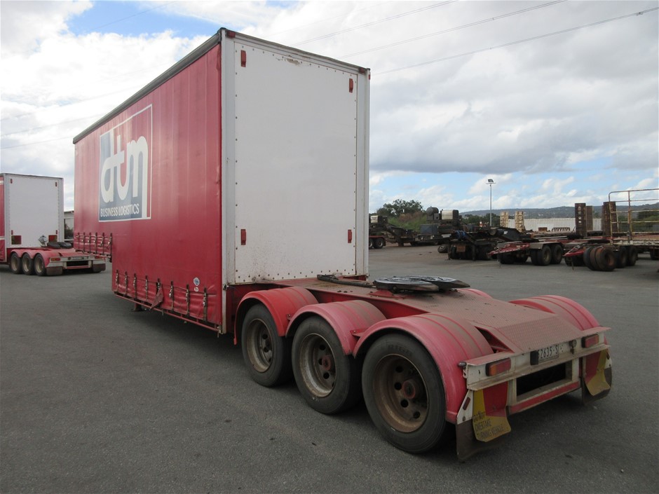 Rash Vest Made With Water Reactive Fabric Showing Dolphin Print When Wet