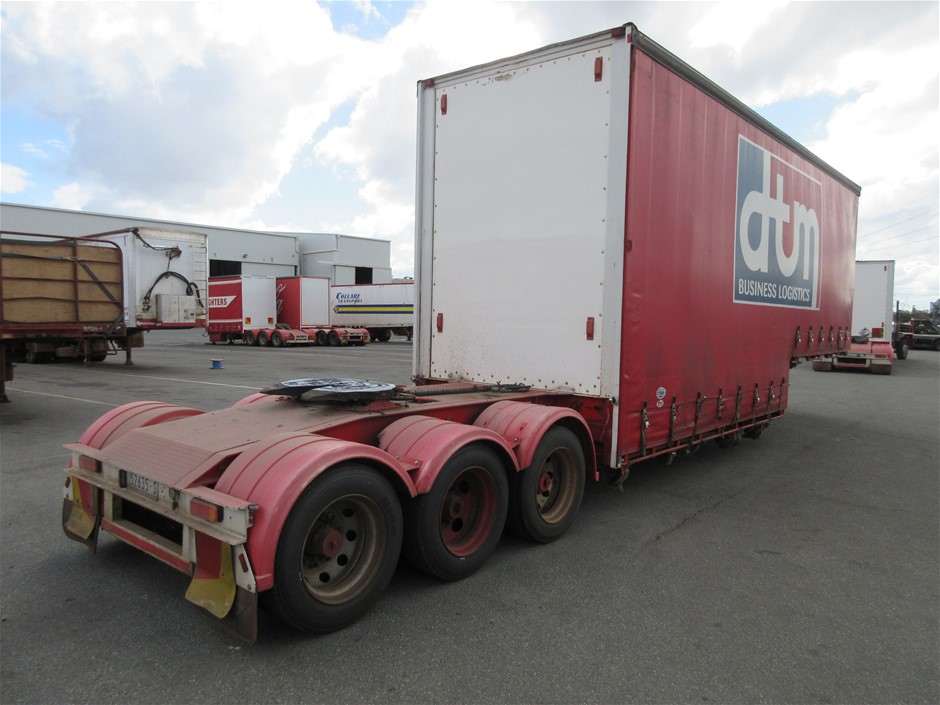 Rash Vest Made With Water Reactive Fabric Showing Dolphin Print When Wet