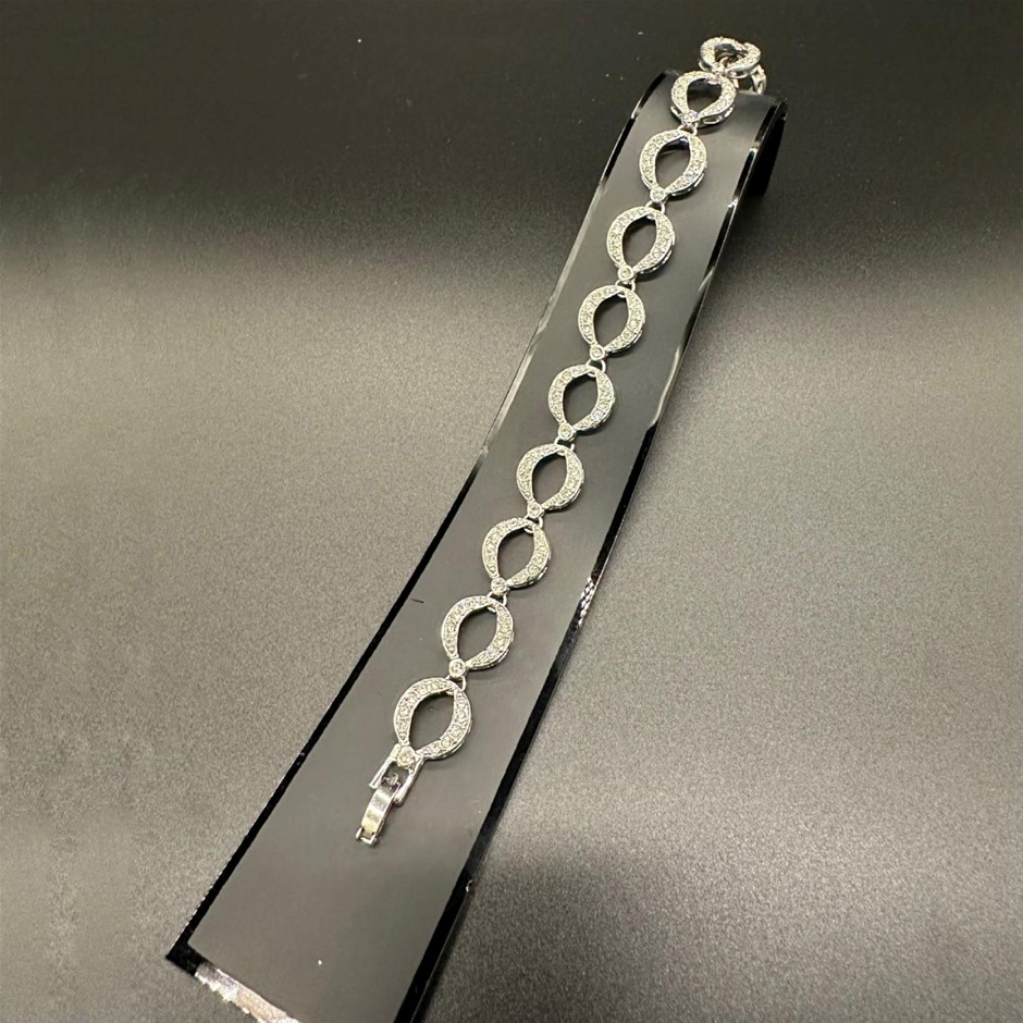 Designer Simulated Diamond Oval Loop Bracelet in Silver