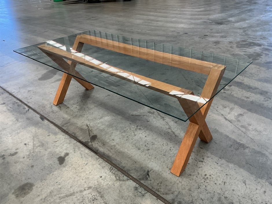 <p>Glass Top Dining Table With Wooden Legs</p>