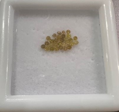 0.20 TCW yellow round various diamonds