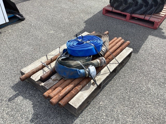 <p>Pallet Containing Flat Hoses And Metal Rods</p>
