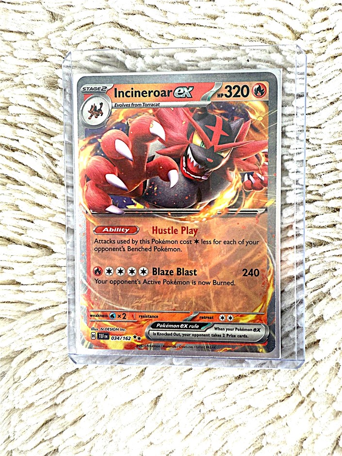 Incineroar ex 320HP fire-type modern Pokémon card.