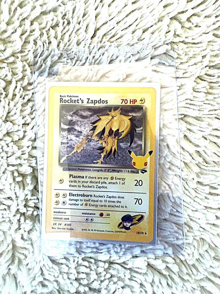 Rocket’s Zapdos 25th Anniversary reprint holo card.