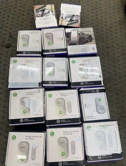 END OF LEASE SALE: Large quantity of garage door remote with sensor