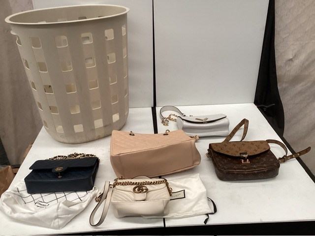Washing Basket Containing Brand Label Handbags/Purses