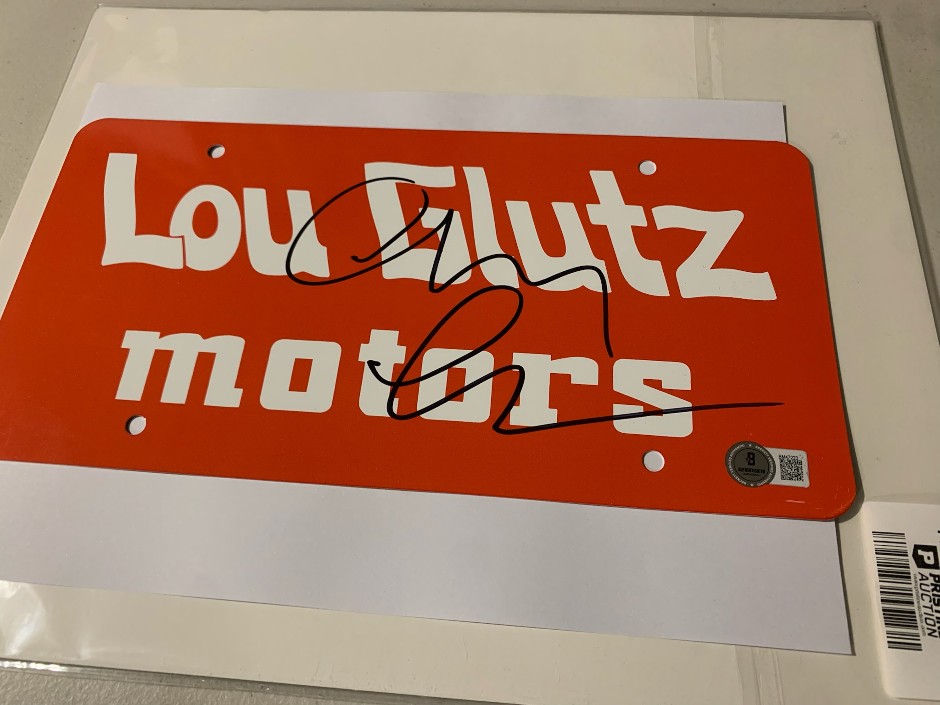 <p>Chevy Chase signed Vacation metal licence plate - Beckett authentication