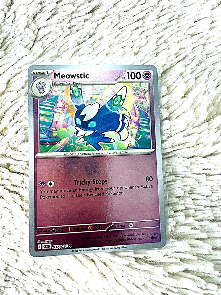 Meowstic holo card featuring the Psychic-type Pokémon in colourful artwork.