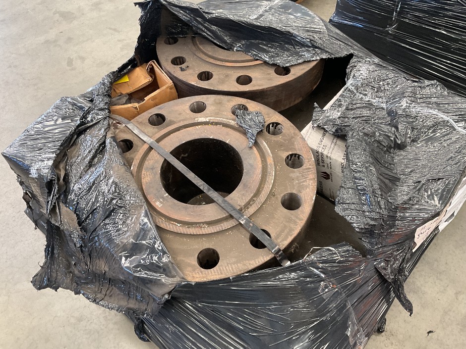 <p>Pallet of industrial flanges</p>