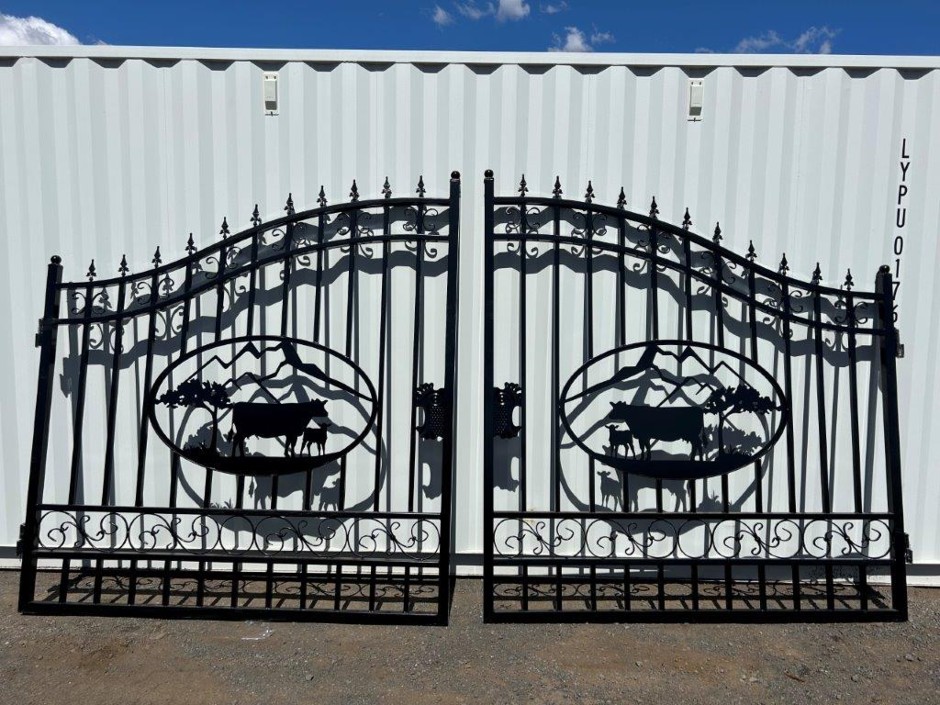 <p>Set of 2 7ft Cow Design Wrought Iron Style Gates (Unused)</p>
