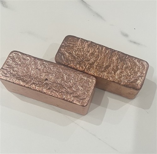 two half kilo copper bars