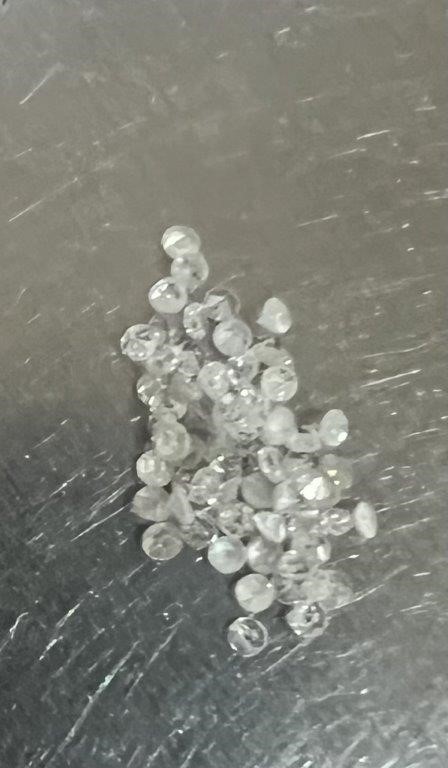 0.16 TCW white various round diamonds